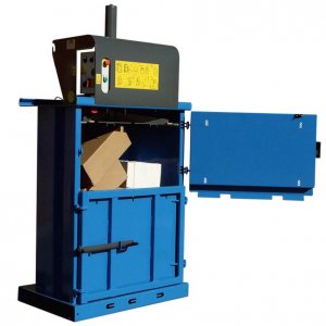 A vertical baling press producing a cardboard bale